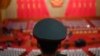 资料照片: 2024年3月5日解放军乐团成员在全国人民代表大会开幕式前站立。