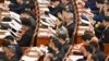 人大代表在北京出席中国第十四届全国人民代表大会三次会议第二次全体会议。(2025年3月8日)