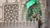 Syria's interim prime minister Mohammad al-Bashir addresses a crowd at the capital's landmark Umayyad Mosque on December 13, 2024. (Photo by Sameer Al-Doumy / AFP)